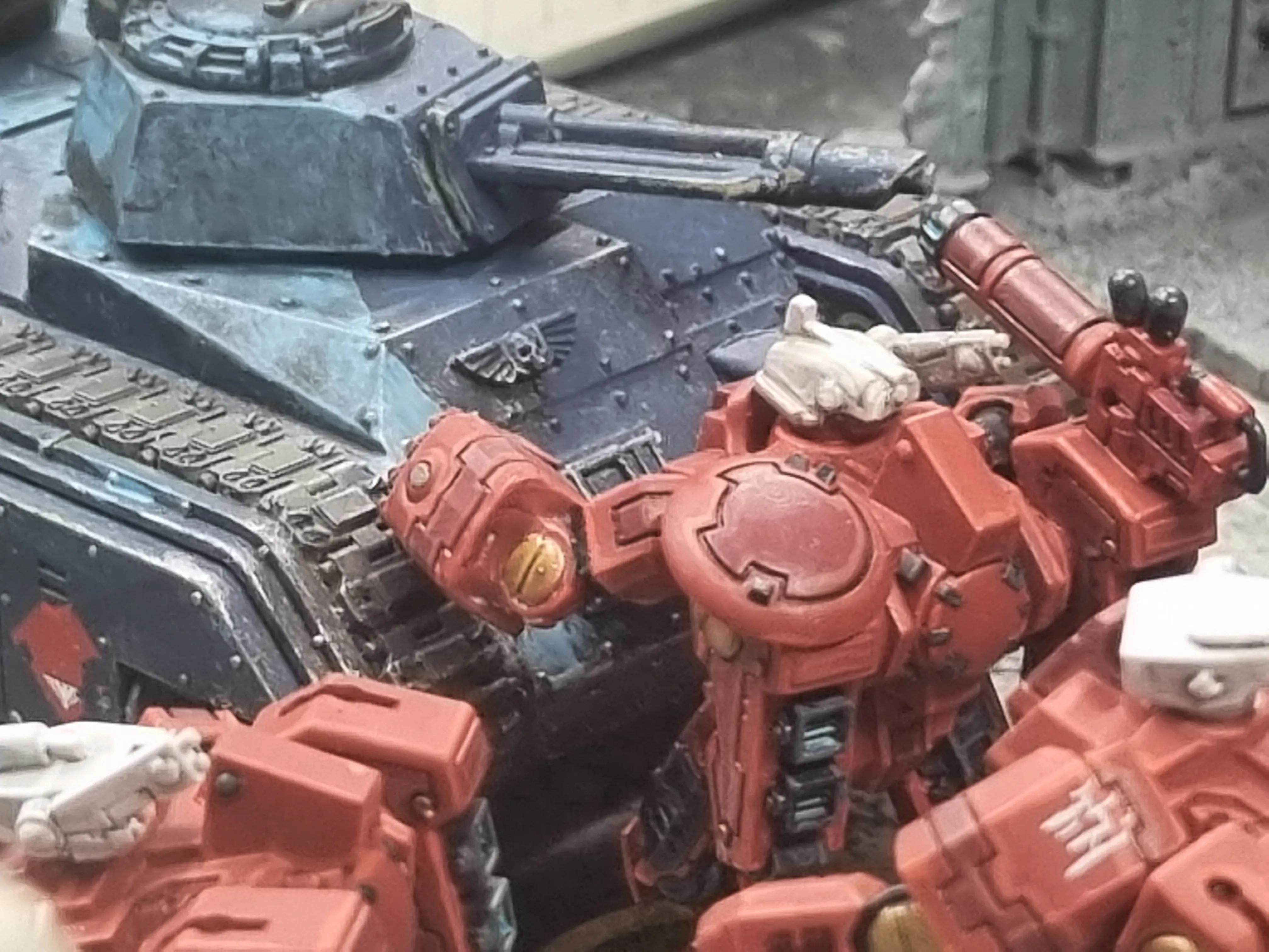 Crisis suit in melee combat with a Chimera APC